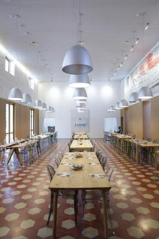 Refettorio Ambrosiano: Set in an abandoned theatre in the suburbs of Milan, this community kitchen welcomes the socially vulnerable and offers a daily three-course dinner service, prepared with surplus ingredients collected from markets and supermarkets across Milan