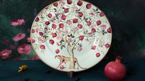 For the holiday table: Good Earth’s Pomegranates and Roses collection