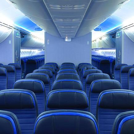 787 dreamliner commercial airplane cabin interior with blue leather seats