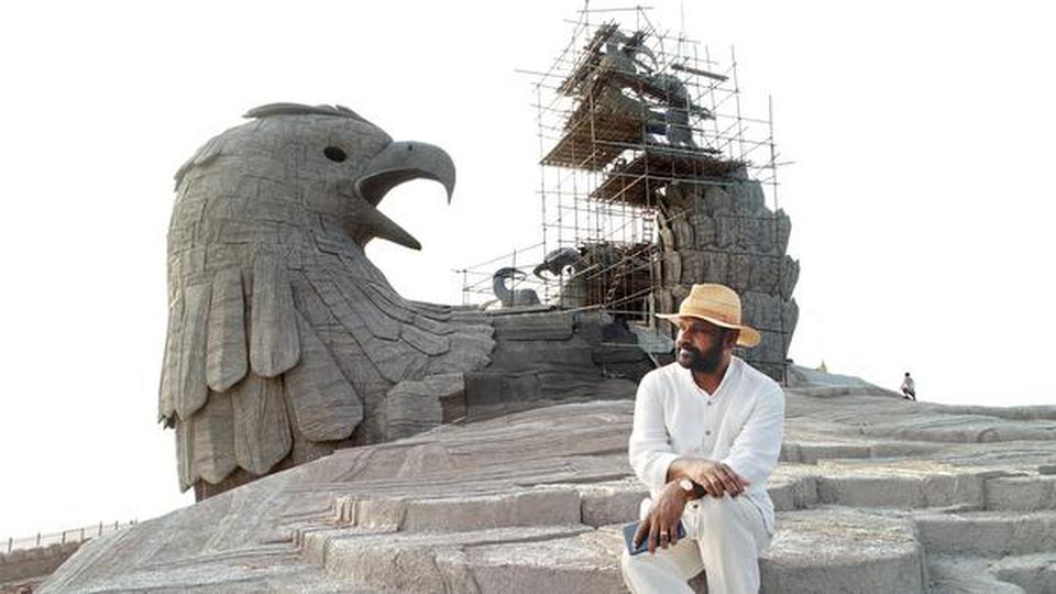 Rajiv Anchal, sitting on the wing of the Jatayu sculpture