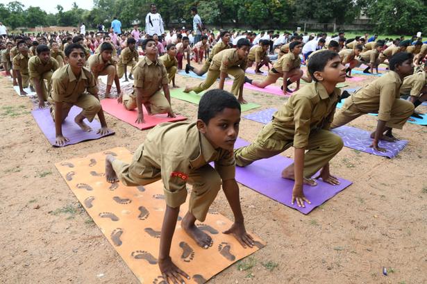 NCC cadets perform yoga at the Government Arts College grounds in Coimbatore on June 21, 2018.