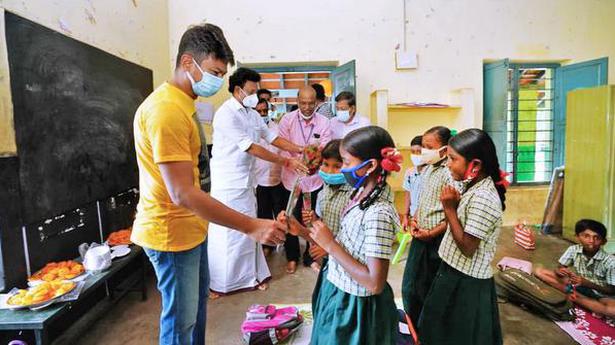 Students welcomed with sweets, flowers in Coimbatore