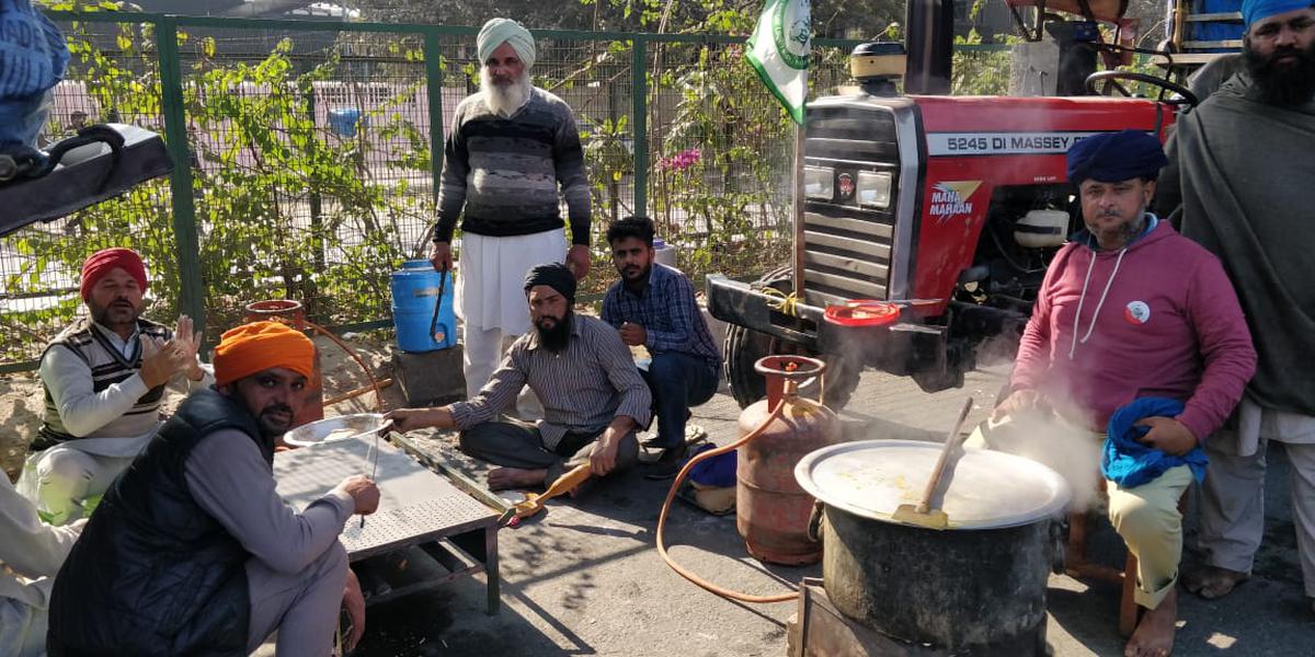 Stopped by the Delhi Police at Tikri Border the farmers from Punjab and Haryana cooking meals and taking rest waiting for more convoys from behind to join them.