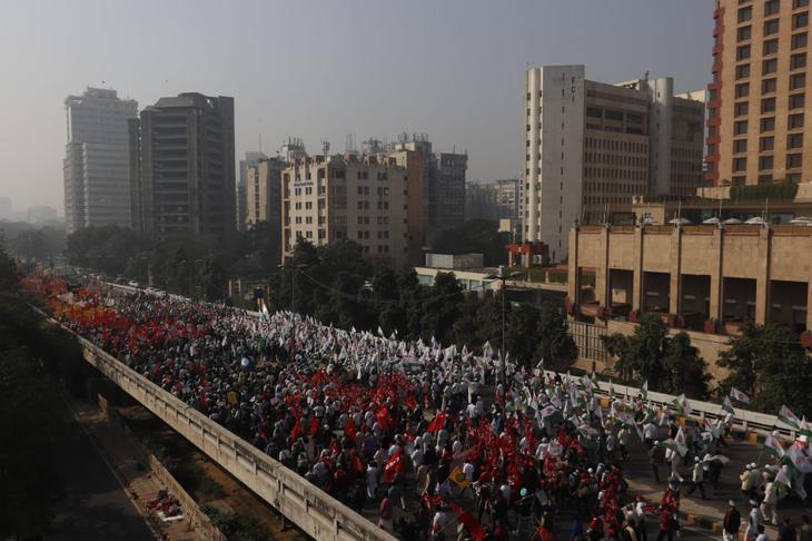 Farmers march on the Ranjit Singh Flyover on Friday.