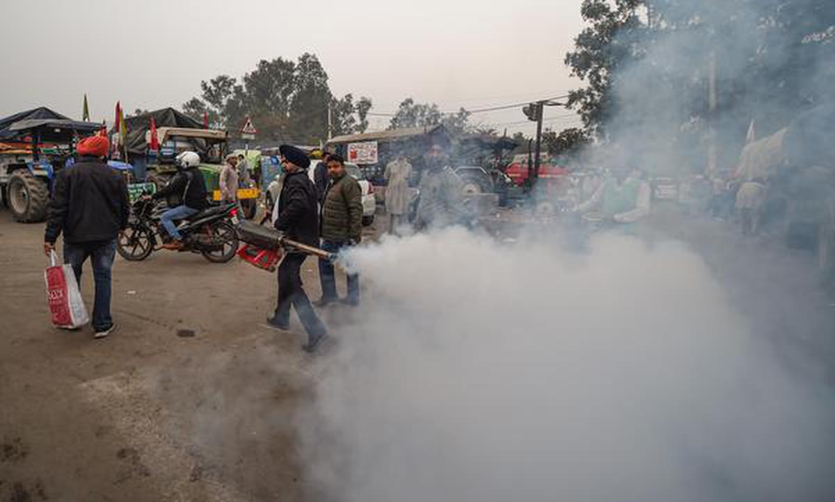 Fumigation being carried out at the Singhu border during farmers' 'Delhi Chalo' protest march against the new farm laws, in New Delhi on December 6, 2020.