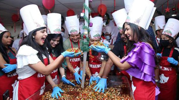 College students usher in Xmas season with cake mixing