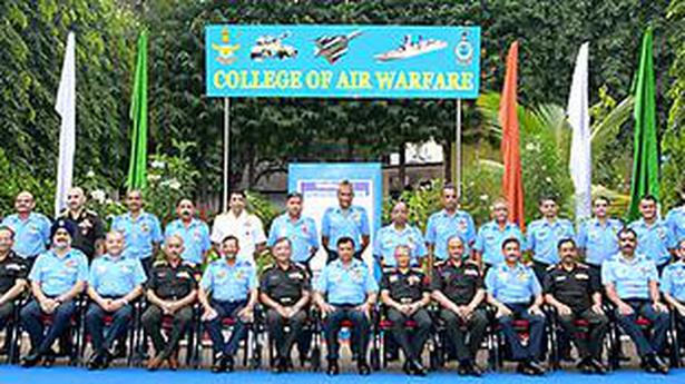 Tri-service officers interact at CAW