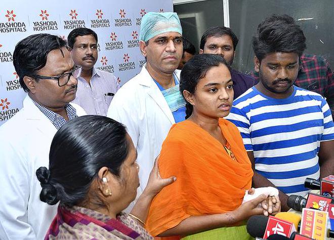 Madhavi addressing the media along with her husband B. Sandeep and doctors of Yashoda Hospitals at Somajiguda in Hyderabad on Wednesday.