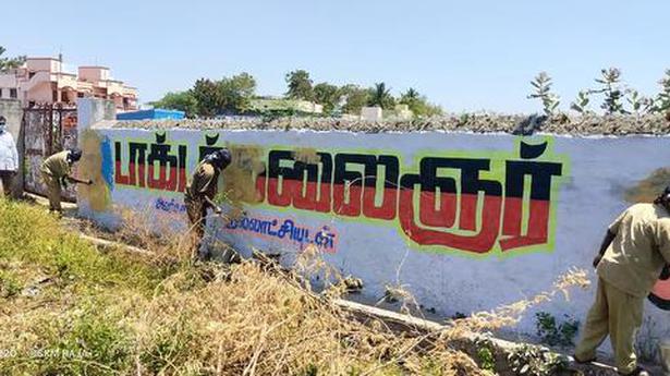Wall writings, banners being cleared: Collector