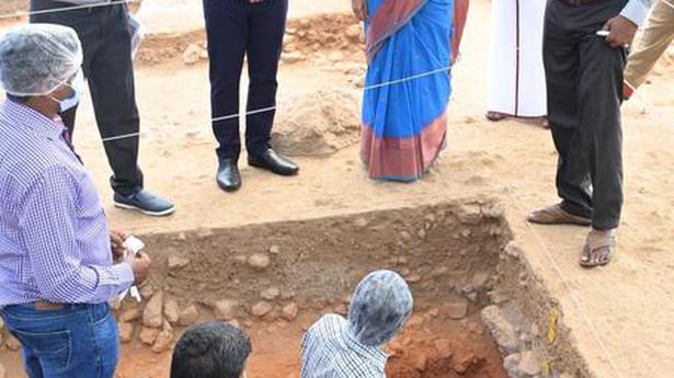 Burial urn containing human skull, bones unearthed