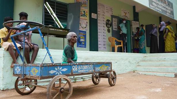 Travelling on a push cart to cast her vote