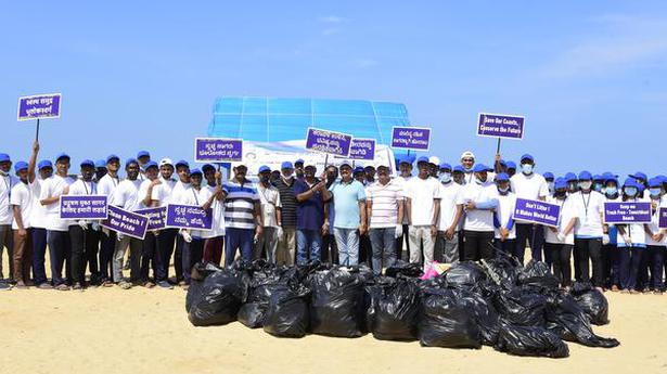 College students, staff and locals clean beach