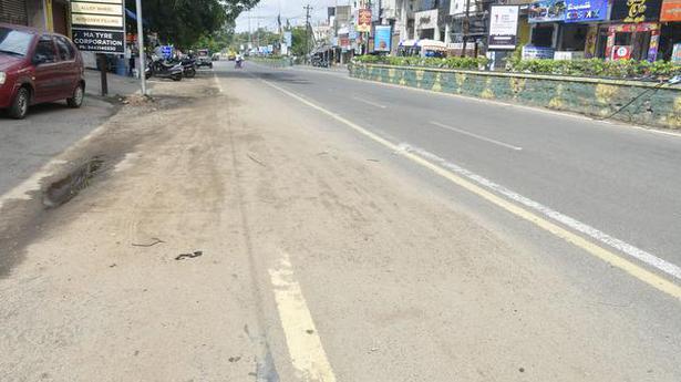 Accumulation of fine sand along city roads poses threat to road users