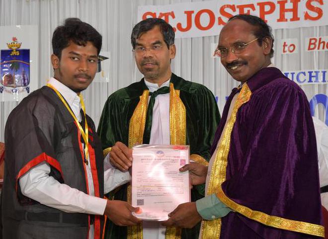 K. Sivan, ISRO Chairman and Secretary, Department of Space, handing over degree certificate to a student at the Graduation Day of St. Joseph's College in Tiruchi on Sunday.