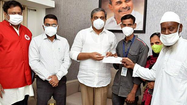 Sajjala presents cheque for ₹50,000 to poor athlete