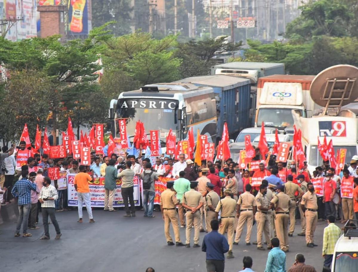 Activists and leaders of the Left parties and trade unions stage a protest on the national highway at Maddilapalem in Visakhapatnam as part of the Bharat Bandh on Friday.