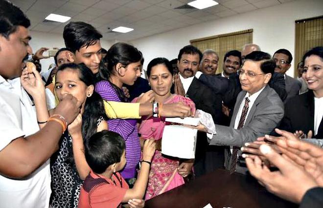 Image result for chief justice of Deepak Mishra has united a couple in a special Lok adalat event held in Karnataka