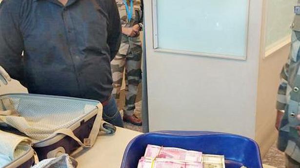 Couple caught with ₹74.8 lakh at airport