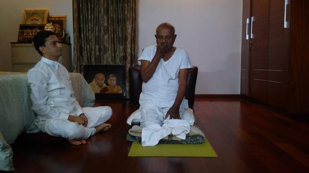 Former Prime Minister H.D. Deve Gowda practises yoga at his residence.