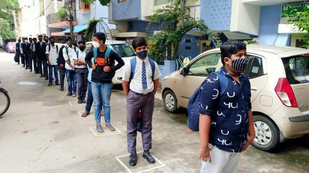 Children queue up as schools reopen