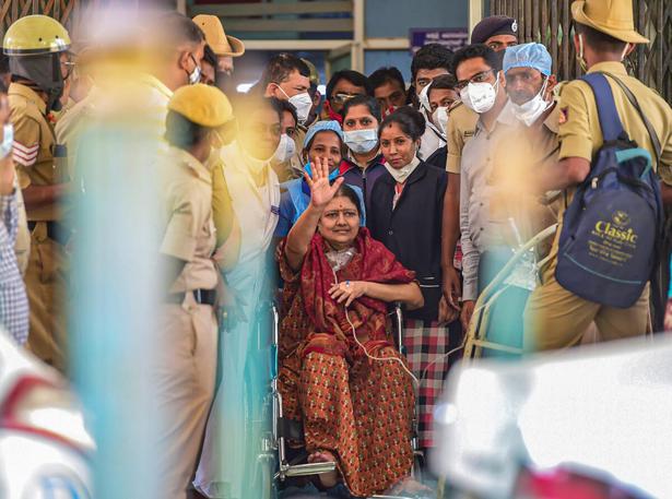 V.K. Sasikala, aide of former Tamil Nadu Chief Minister Jayalalithaa, waves to supporters as she is taken to Victoria Hospital in Bengaluru on January 21, 2021.