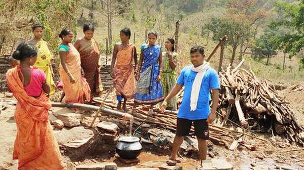 Tribal people bring water to their two villages - The Hindu