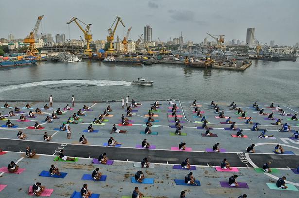 Western Naval Command personnel getting ready for a yoga demonstration on the deck of INS Viraat in Mumbai on International Yoga Day on June 21, 2018.