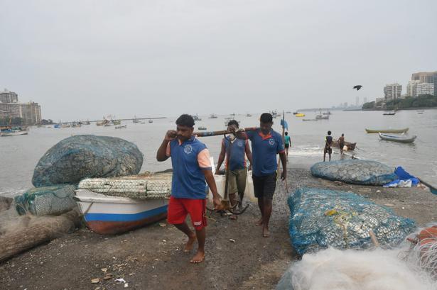 Fishermen bring their boat anchor back in shore at Badhwar park in Mumbai on June 2, 2020. Fishermen have been instructed not to venture in Arabian sea due to approaching cyclone.