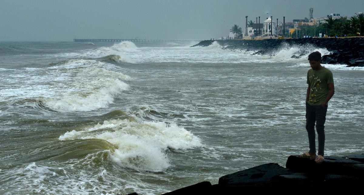 The sea remained rough in Puducherry with waves crashing against rocks at the old pier following heavy rains in Puducherry on Tuesday.