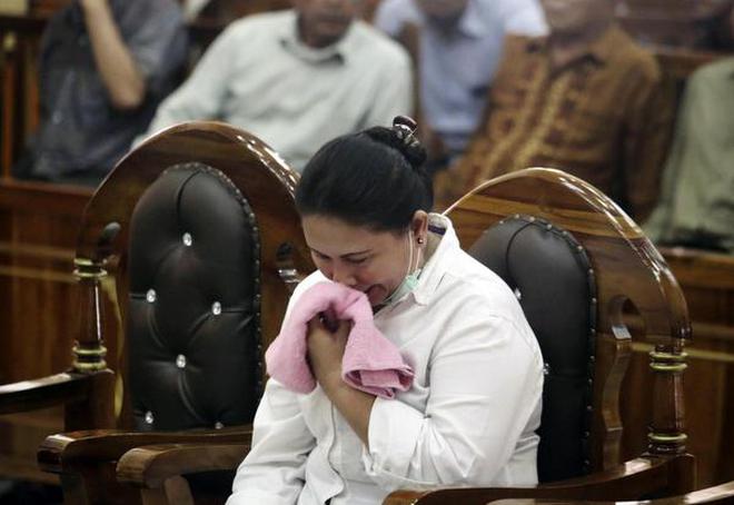 Ethnic Chinese woman Meiliana reacts during her sentencing hearing at a district court in Medan, North Sumatra, Indonesia, Tuesday, Aug. 21, 2018.