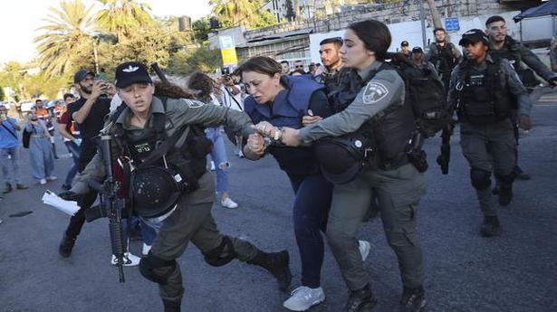 Israel arrests Jerusalem activist as reporter recovers