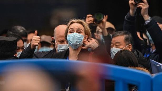 Thea Fisher (centre) and other members of the World Health Organisation team, investigating the origins of the COVID-19 coronavirus, visit the closed Huanan Seafood wholesale market at Wuhan in China's Hubei Province on January 31, 2021.