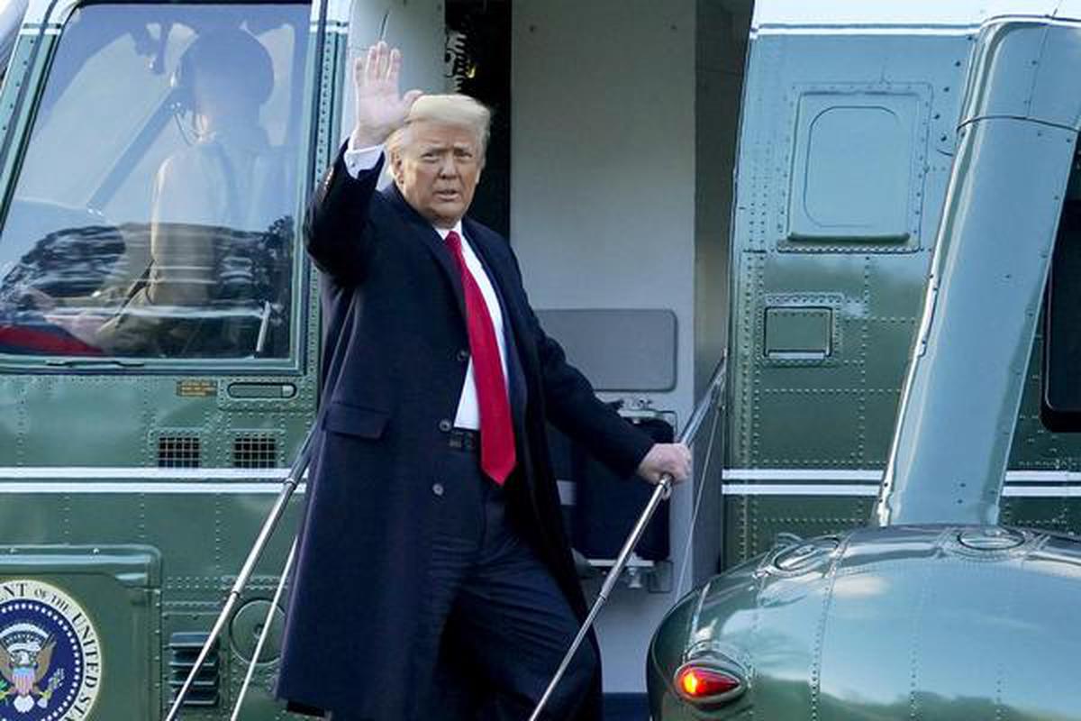 President Donald Trump waves as he boards Marine One on the South Lawn of the White House, Wednesday, Jan. 20, 2021, in Washington.