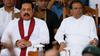 Sri Lanka’s newly-appointed Prime Minister Mahinda Rajapaksa and President Maithripala Sirisena look on during a rally near the Parliament in Colombo on November 5, 2018.