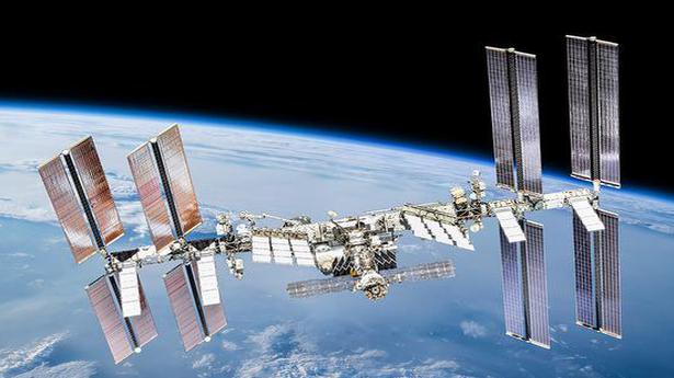 Space junk sends station astronauts into docked capsules