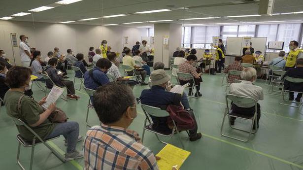 Japan opens mass vaccination centres 2 months before Games
