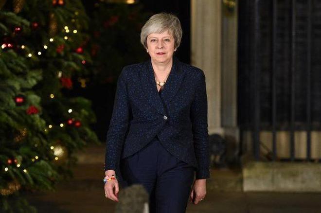 Britainâ€™s Prime Minister Theresa May arrives to make a statement outside 10 Downing Street after winning the confidence vote in London on December 12, 2018.
