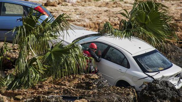 Floods sweep cars into sea, damage homes in northeast Spain
