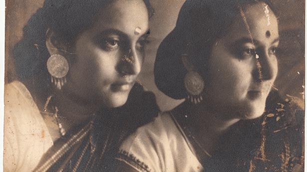 Exhibition brings together photos taken by 1919-born twin sisters