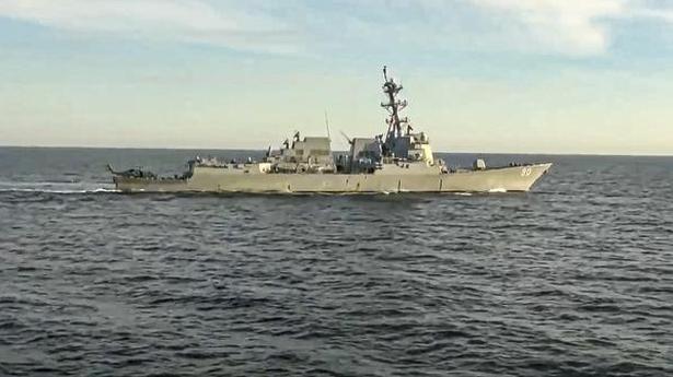 Russia says it pushed U.S. destroyer from area near its waters