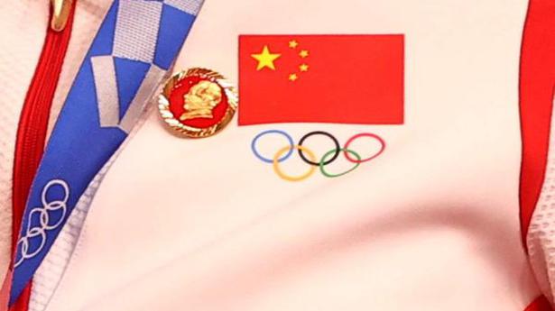 Mao pins worn by Chinese athletes may test Olympic rules