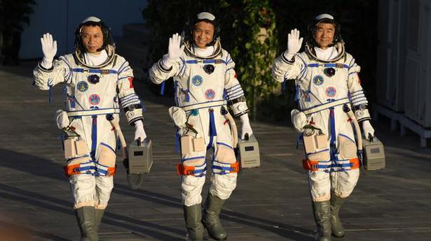 Chinese astronauts dock with space station