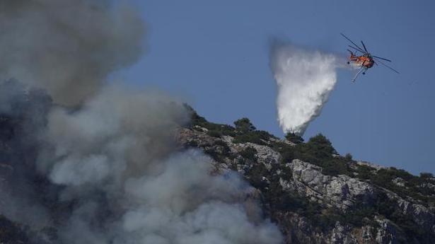 Fires rampage through forests in Greece; thousands evacuated