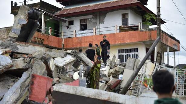 At least 34 dead as Indonesia quake topples homes, buildings