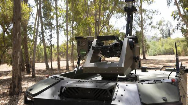 Israeli firm unveils armed robot to patrol borders
