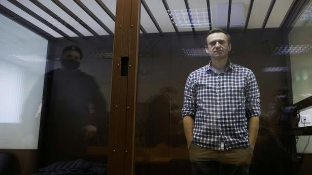 Jailed Kremlin critic Alexei Navalny says he risks solitary confinement over infractions
