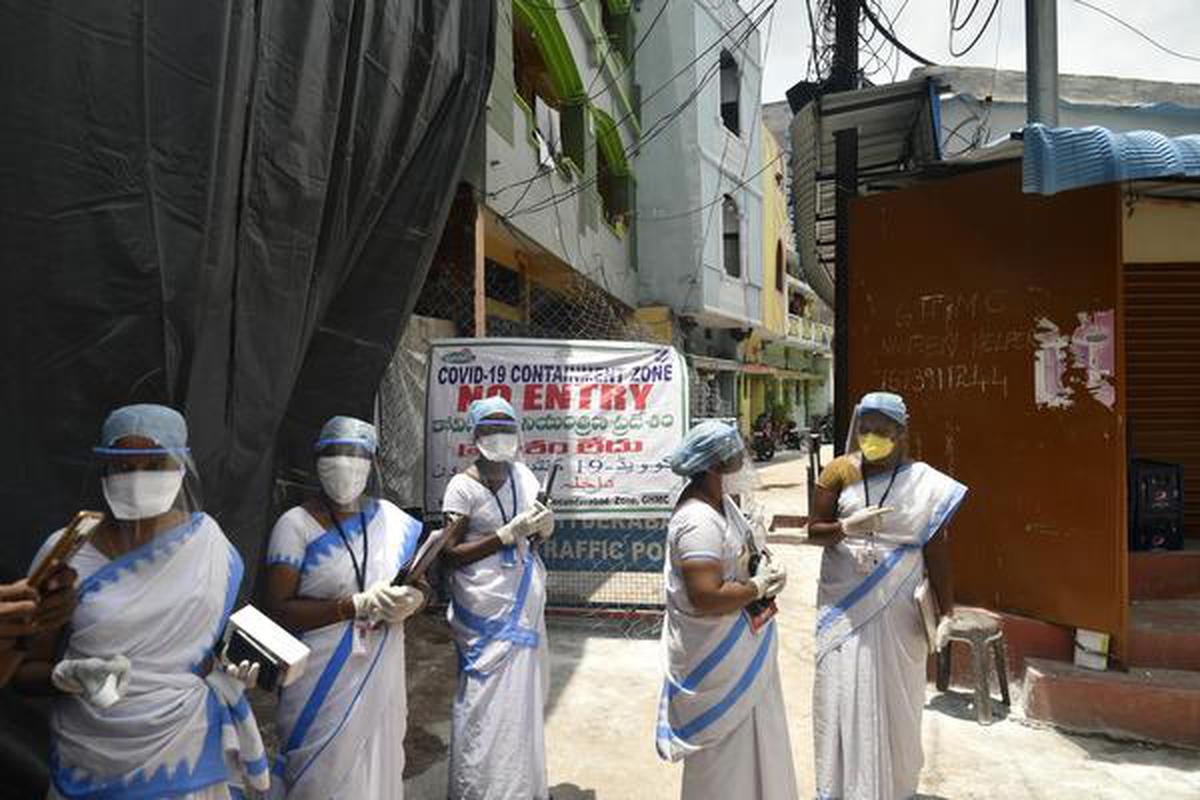 A group of Accredited Social Health Activists (ASHA) workers are seen at a containment zone. File