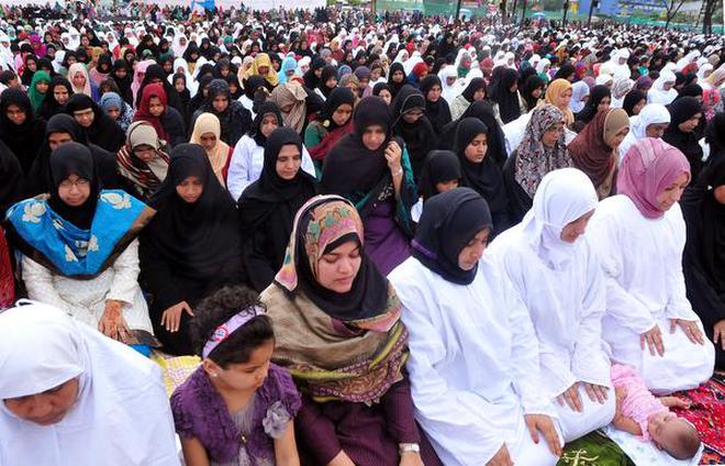 Muslim women offering prayers at a Idgah on the Kozhikode beach. File
