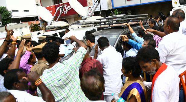 A private television channel's vehicle being attacked by DMK cadres outside Kauvery Hospital in Chennai on Tuesday.