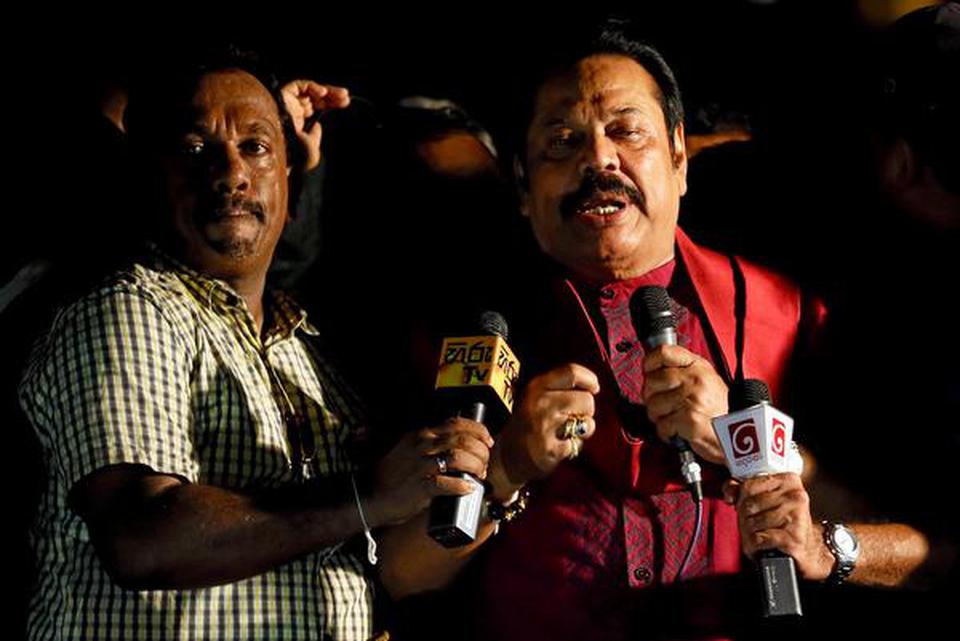 Sri Lanka’s former President Mahinda Rajapaksa speaks to his supporters during an anti-government protest in Colombo on September 5, 2018.